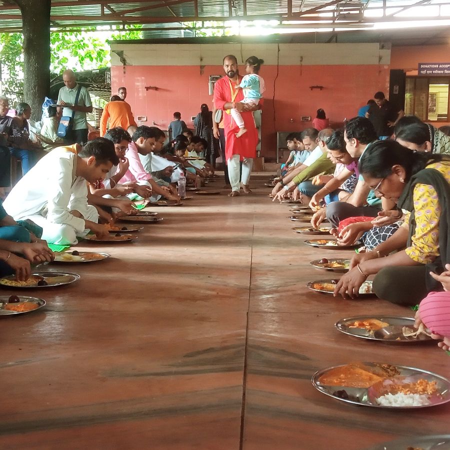 Community members sharing a meal together at Evolve Pune